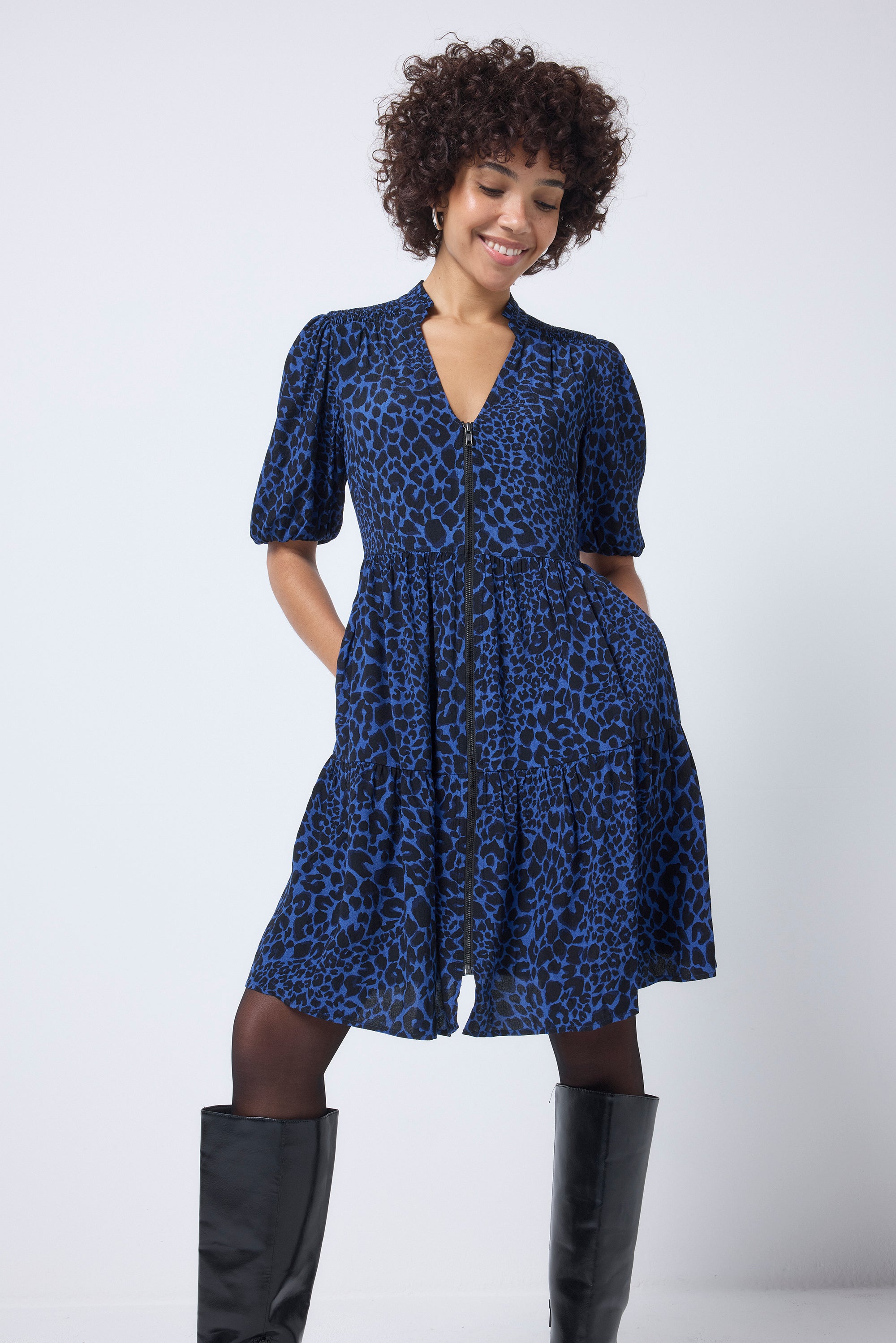 Scamp and Dude Navy with Black Rock and Roll Leopard Zip Detail Tiered Short Dress | Model wearing a short navy zip detail dress paired with black tights and knee high boots.