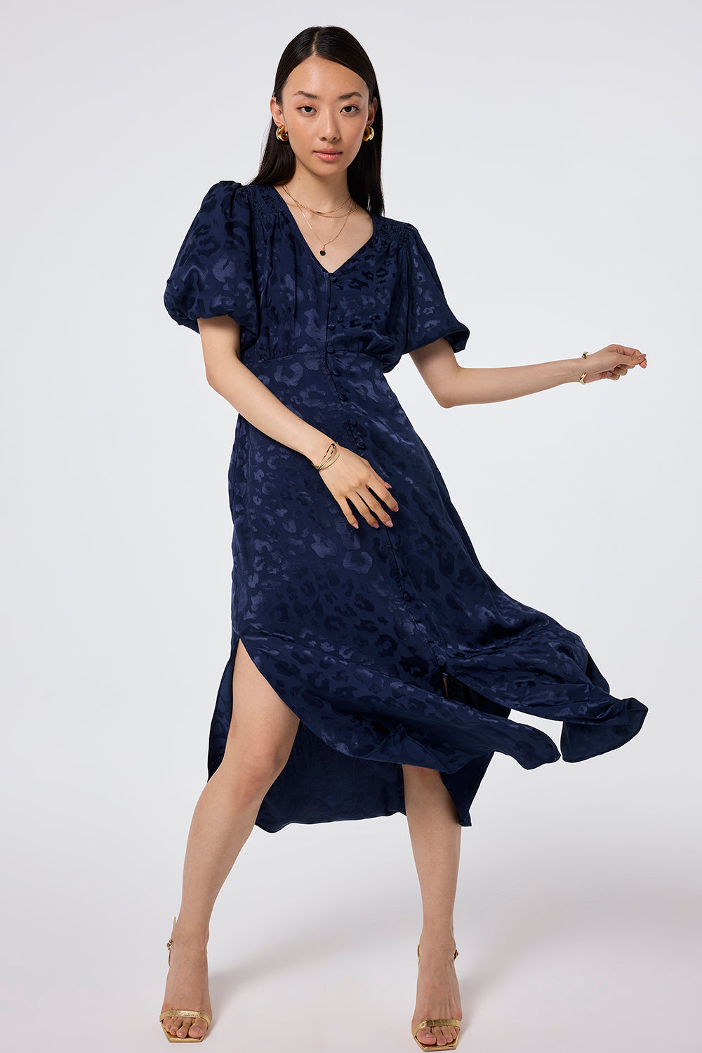 Scamp and Dude Navy Jacquard Leopard Puff Sleeve Midi Tea Dress | Model wearing navy jacquard puff sleeve midi dress featuring all over leopard print.