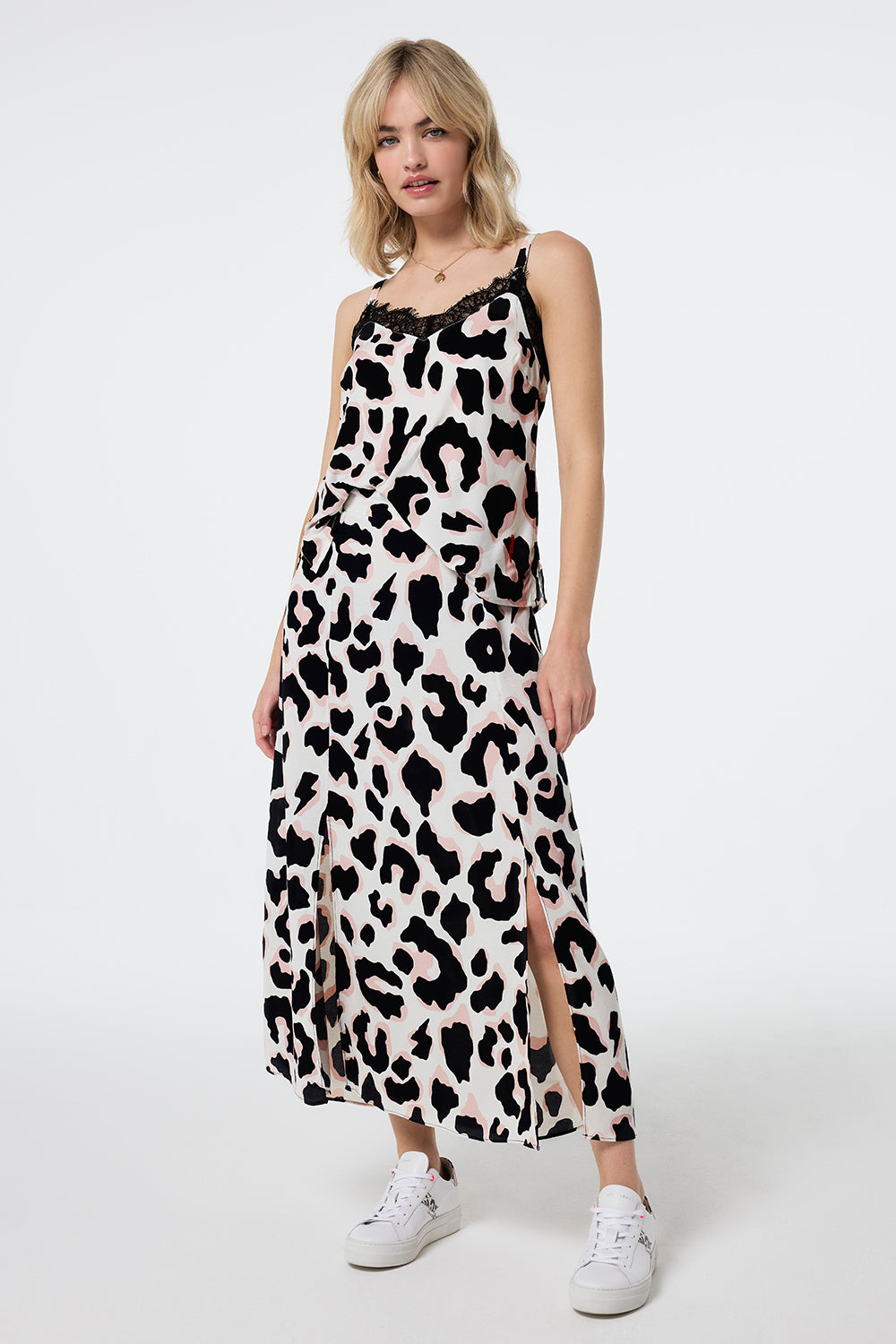 Scamp and Dude Ivory with Neutral and Black Mega Shadow Leopard Split Front Skirt | Model wearing a matching cami top and split front skirt in an ivory colour with neutral and black leopard print.