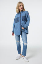 Scamp and Dude Mixed Wash Indigo Oversized Denim Shirt | Model wearing a denim oversized shirt with mixed wash details including lightning bolt pockets.