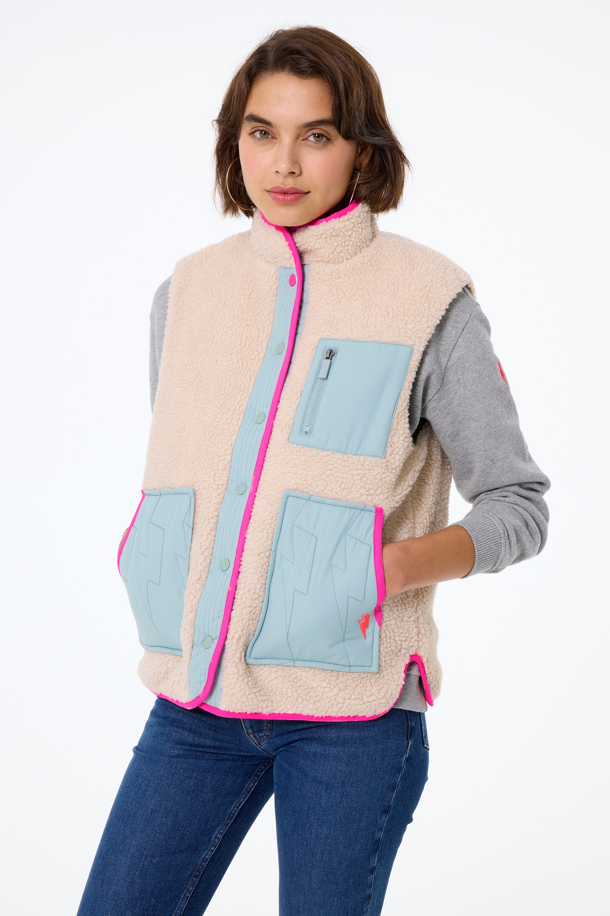 Scamp and Dude Khaki Reversible Quilted Lightning Bolt with Borg Gilet | Model wearing authentic indigo jeans with a grey sweatshirt and a reversible gilet.