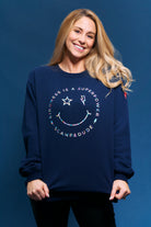 Scamp and Dude Scamp & Dude x Style For Stroke Navy with Rainbow Foil Smiley Face Oversized Sweatshirt | Model wearing dark navy jumper with rainbow foil smiley face graphic print.