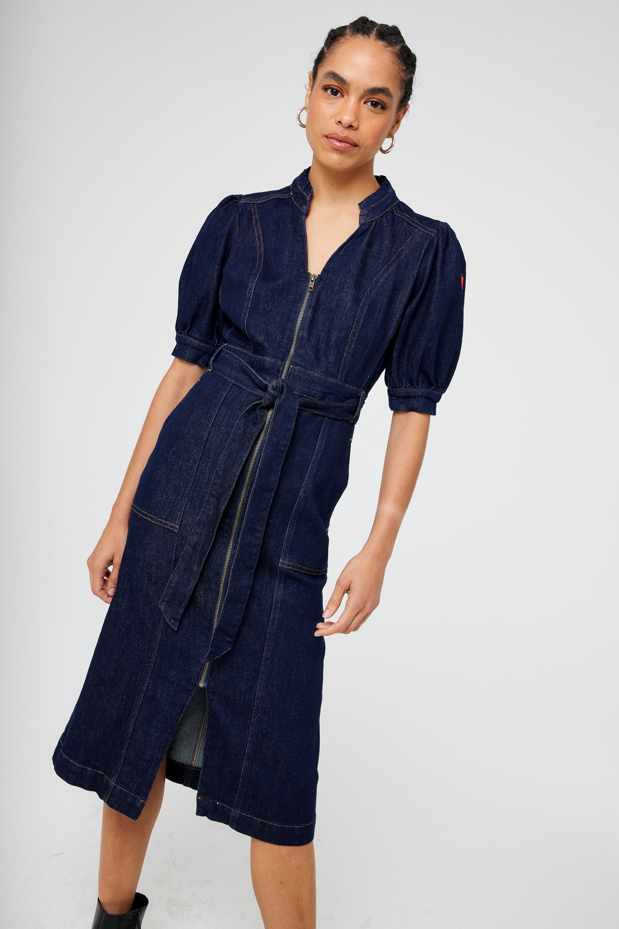 Scamp and Dude Rinse Wash Zip Detail Denim Dress | Model with wearing a dark denim wash dress with black heel boots