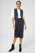 Scamp and Dude Washed Black Studded Denim Scallop Waistcoat | Model wearing washed black denim skirt and waistcoat over a white t shirt.